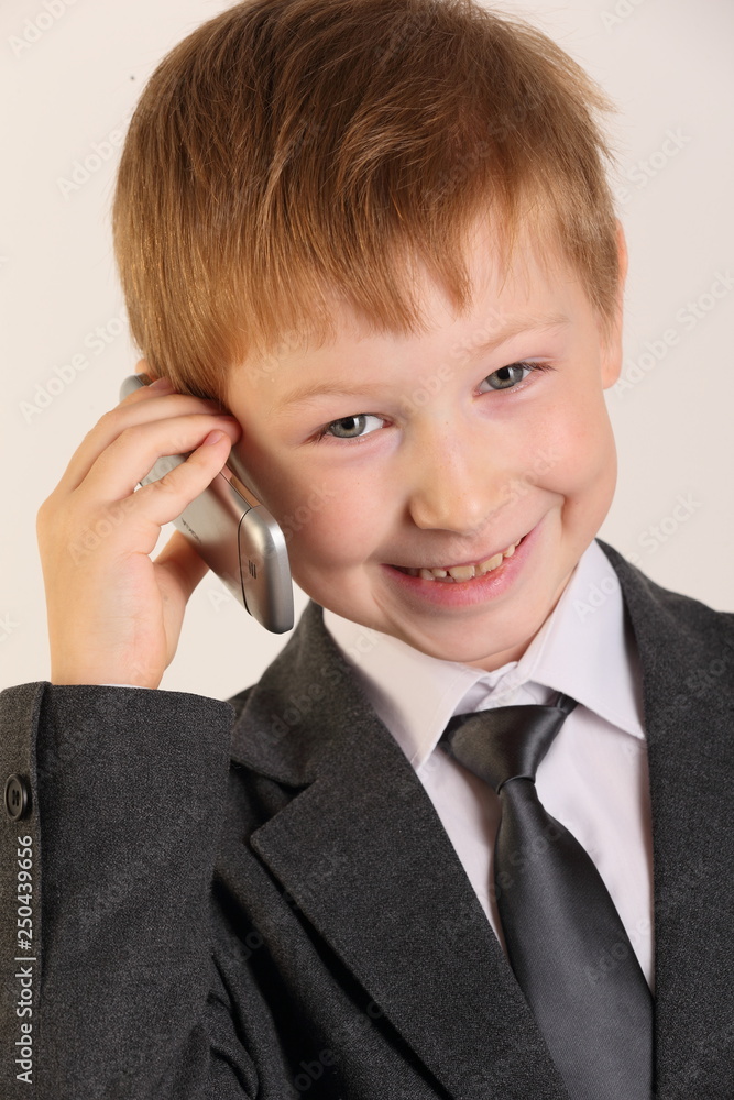 boy, child, child with a phone, schoolboy with a phone, artist, actor, boy actor, young model, portrait boy, school suit, school uniform, tie, conversation, blond, posing, studio boy, child, child with a phone, schoolboy with a phone, artist, actor, boy actor, young model, portrait boy, school suit, school uniform, tie, conversation, blond, posing, studio