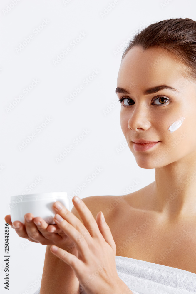 Gorgeous woman holding skin cream. This is the best cosmetic product. Holding Moisturizing Lotion. Beauty Concept Gorgeous woman holding skin cream. This is the best cosmetic product. Holding Moisturizing Lotion. Beauty Concept