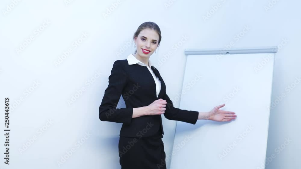 4K. Sexy business woman show something information ,using flipchart. 4K. Sexy business woman show something information ,using flipchart.