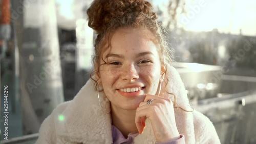 Slow-mo happy attractive sunny redhead joyful university girl student with freckles enjoying urban lifestyle life standing campus smiling giggling looking camera tender pleasant showing happiness