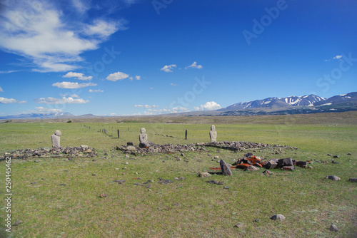 Turkic memorial structures. Turkic Stone Mens. Stone warriors (Kurgan stelae). Two long lines of balbal extending toward Khurgan Lake. Mongolia, Bayan-Olgii Province, Altai Tavan Bogd NP, Shar Bulag photo