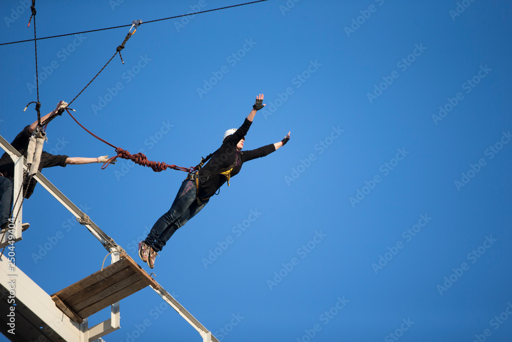Jumping from the bridge with a rope. RoupeJumping Jumping from the bridge with a rope. RoupeJumping