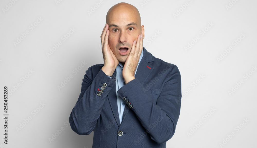 Shocked bald man looking at camera. Isolated Shocked bald man looking at camera. Isolated