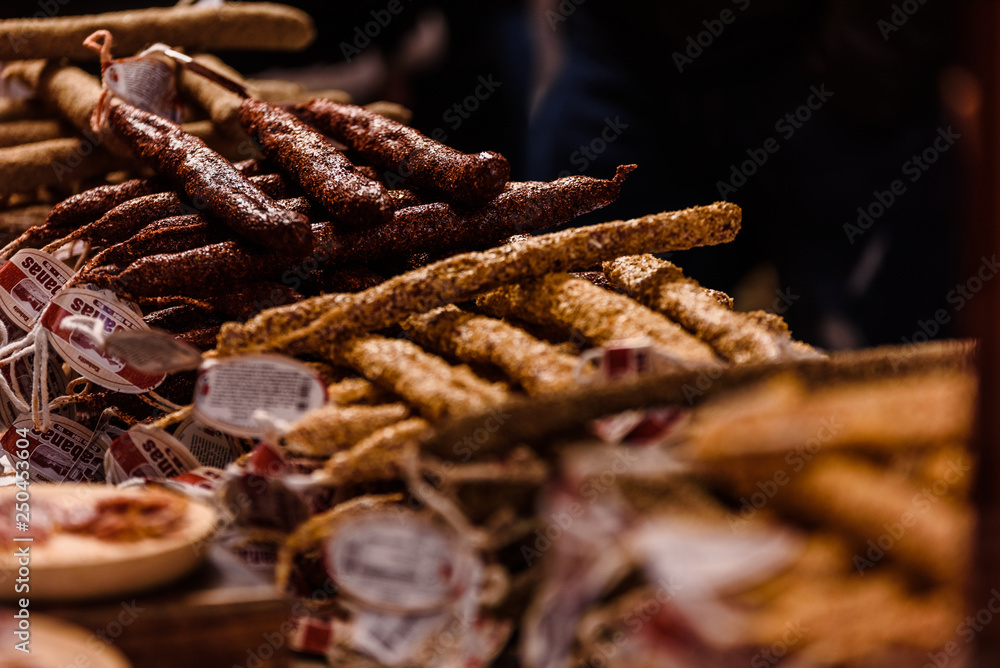 Handmade Iberian pork sausages for sale at a medieval fair. Handmade Iberian pork sausages for sale at a medieval fair.