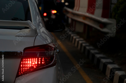 White car on the road in traffic junction at night there are many cars on the road. © thongchainak