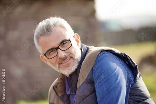 Portrait of mature man in countryside, farming life