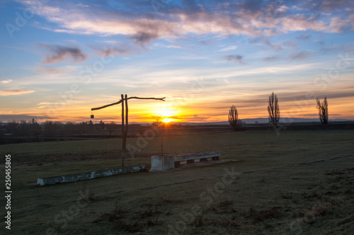 Traditional water well  well sweep or shadoof  in Serbia with a beautifull sunset