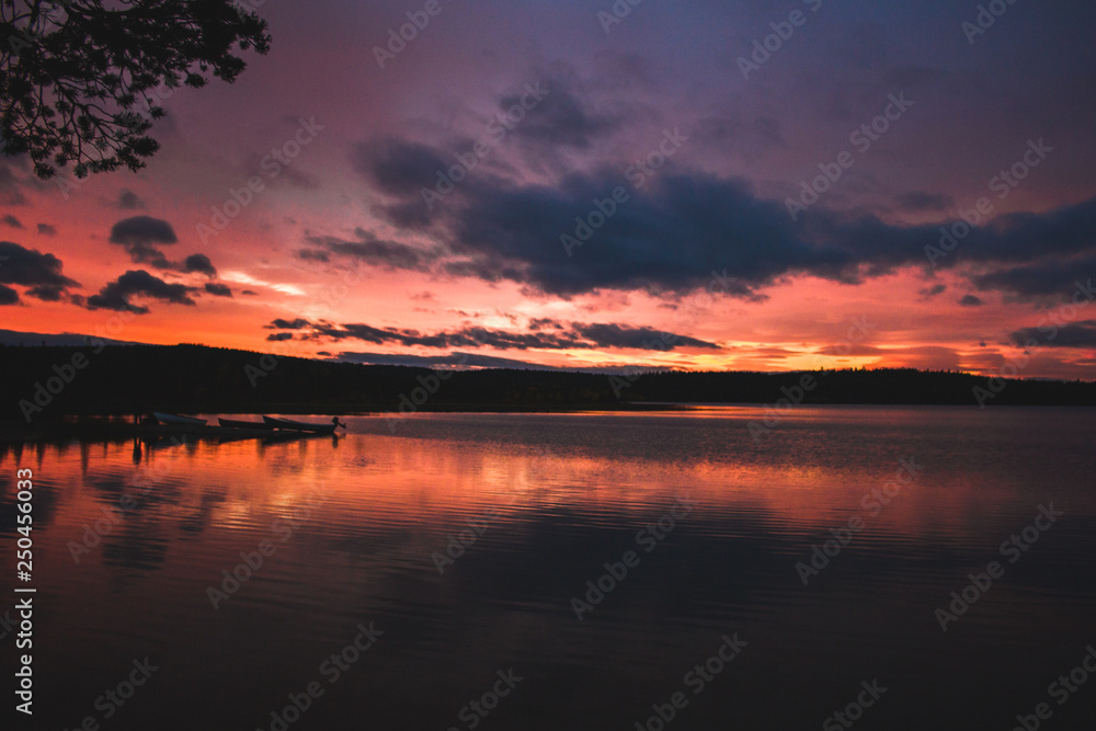 Deep orange sunset on Finnish lake