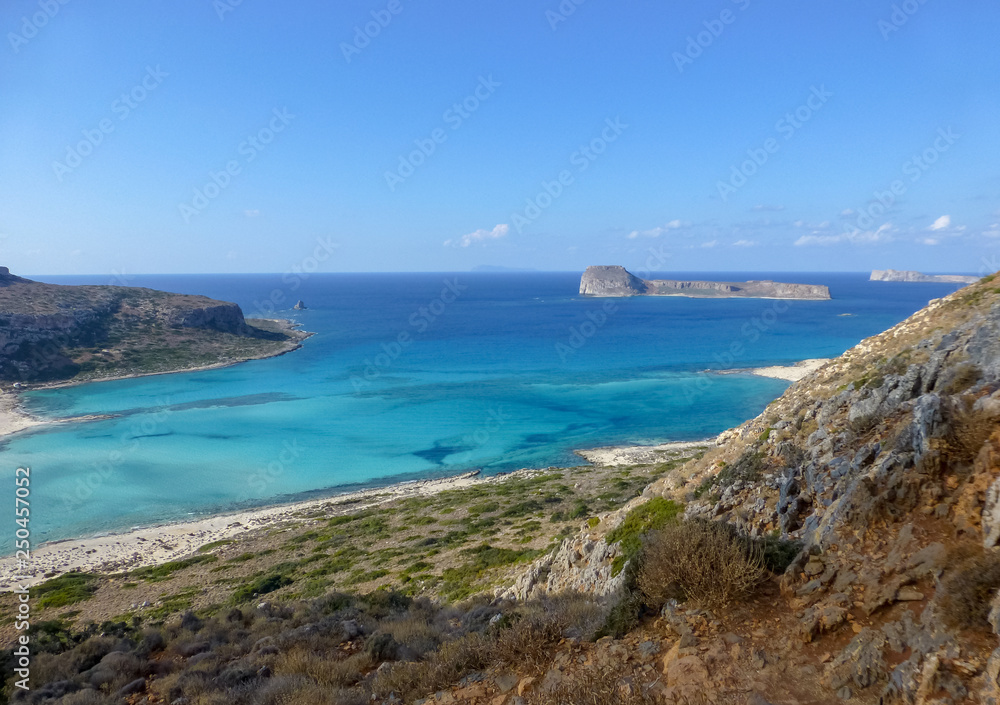 Famous lagoon of Balos beach with white sand and exotic blue and turquoise waters on Crete island, Greece
