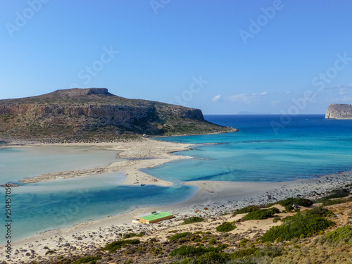 Famous lagoon of Balos beach with white sand and exotic blue and turquoise waters on Crete island, Greece © barmalini
