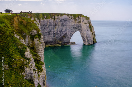 Scenic alabaster chalk cliffs of Etretat and coast of Atlantic ocean, travel and vacation destination in Normandy, France © barmalini