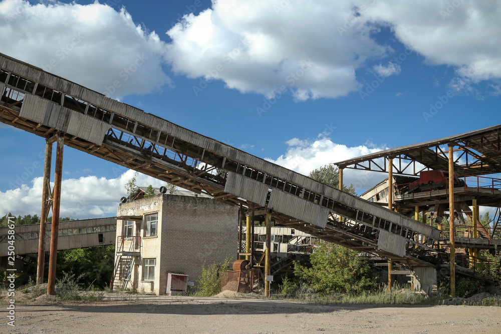Industrial buildings in an old abandoned sand quarry. Image taken in summer daylight.