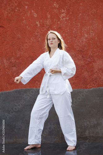 young woman is practising taekwondo martial art © Axel Bueckert