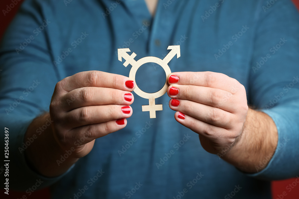 Fototapeta premium Man with manicure showing symbol of transgender, closeup