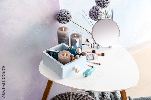 Table with cosmetics and ca...