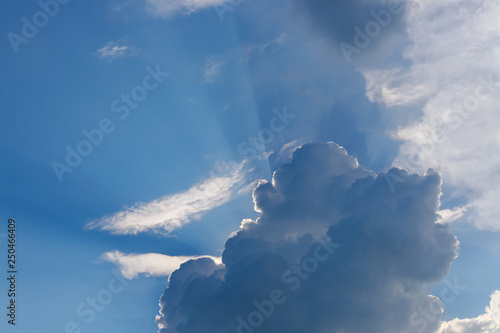sun light shine through cloud on clear blue sky background