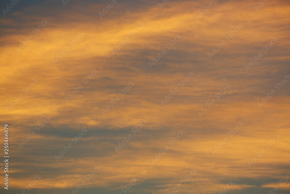 golden sunlight shiny through cloud on dramatic dusk sky