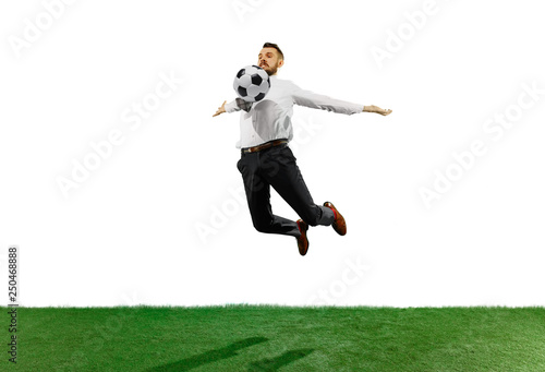 Full length shot of a young businessman playing football isolated on white background. © master1305