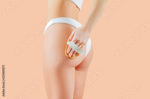 Slimming thighs and buttocks. Woman make anti cellulite massage