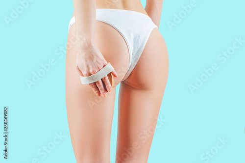 Slimming thighs and buttocks. Woman make anti cellulite massage