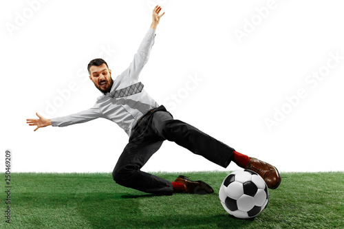 Full length shot of a young businessman playing football isolated on white background.