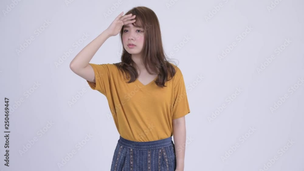 Young beautiful Asian woman searching something Young beautiful Asian woman searching something