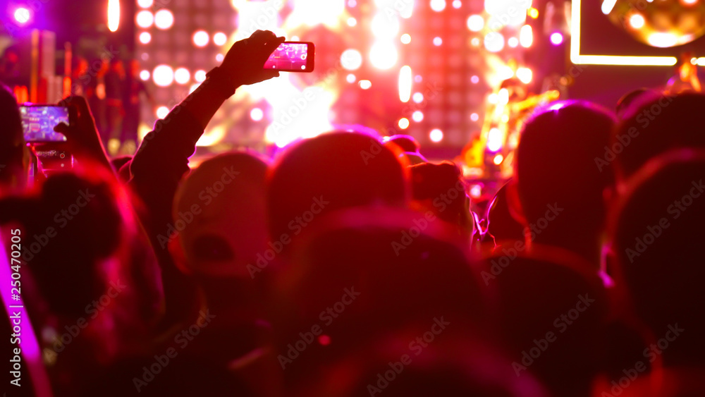 abstract colorful background audience in public concert.