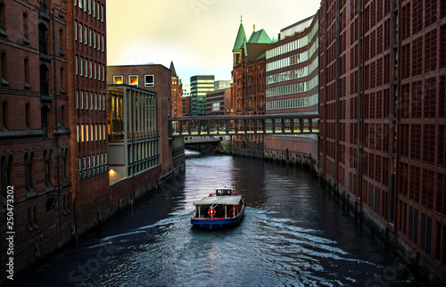 River, boat and modern building with river. Modern Venice. The canals of Hamburg on the Elbe River. Beautiful river channels in the old city of Hamburg, Germany. Free, empty place