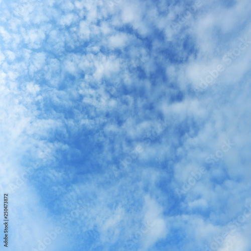 fluffy white cloud on clear blue sky