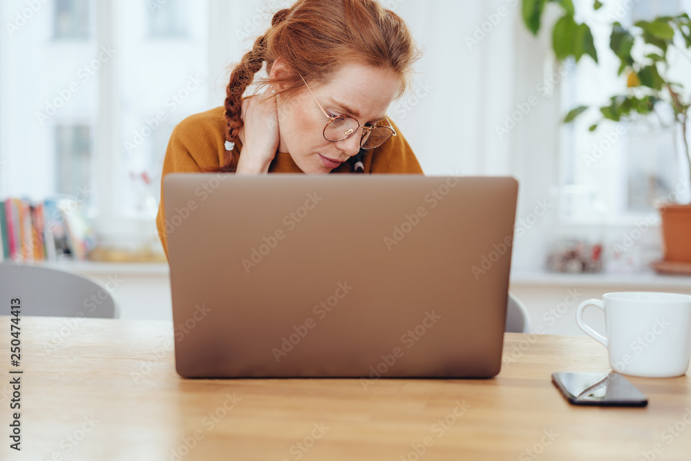 Pretty girl in glasses dreaming sitting at laptop Pretty girl in glasses dreaming sitting at laptop