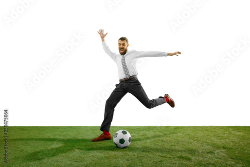 Full length shot of a young businessman playing football isolated on white background. © master1305