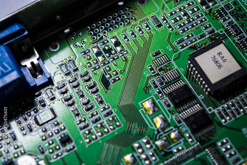The motherboard of green color from the personal computer. Repair. Texture or background. Electronics. Spare parts.