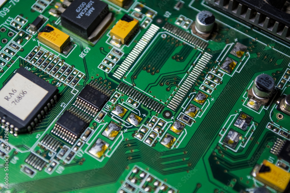 The motherboard of green color from the personal computer. Repair. Texture or background. Electronics. Spare parts. The motherboard of green color from the personal computer. Repair. Texture or background. Electronics. Spare parts.
