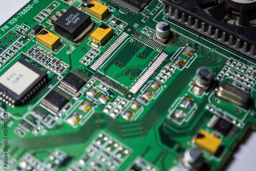 The motherboard of green color from the personal computer. Repair. Texture or background. Electronics. Spare parts. The motherboard of green color from the personal computer. Repair. Texture or background. Electronics. Spare parts.
