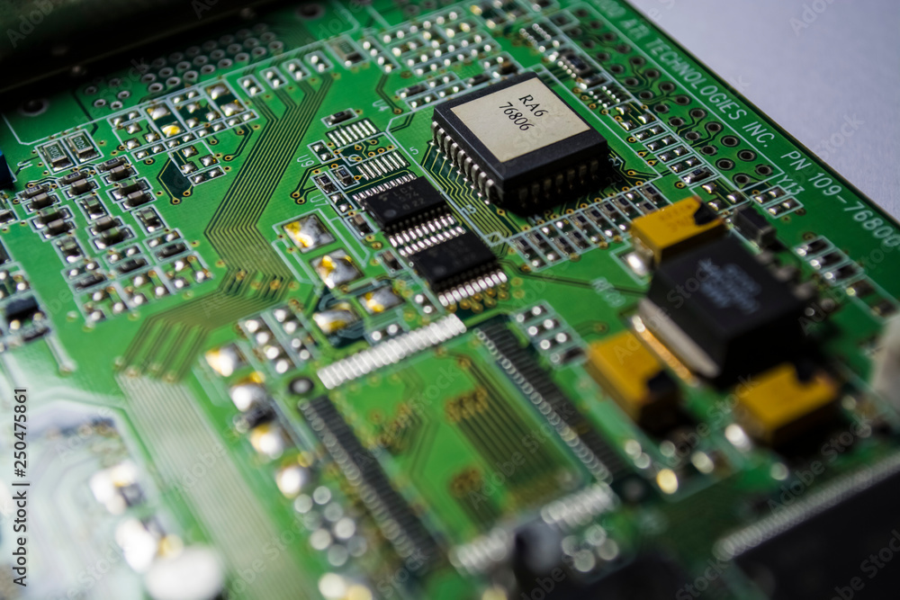 The motherboard of green color from the personal computer. Repair. Texture or background. Electronics. Spare parts. The motherboard of green color from the personal computer. Repair. Texture or background. Electronics. Spare parts.