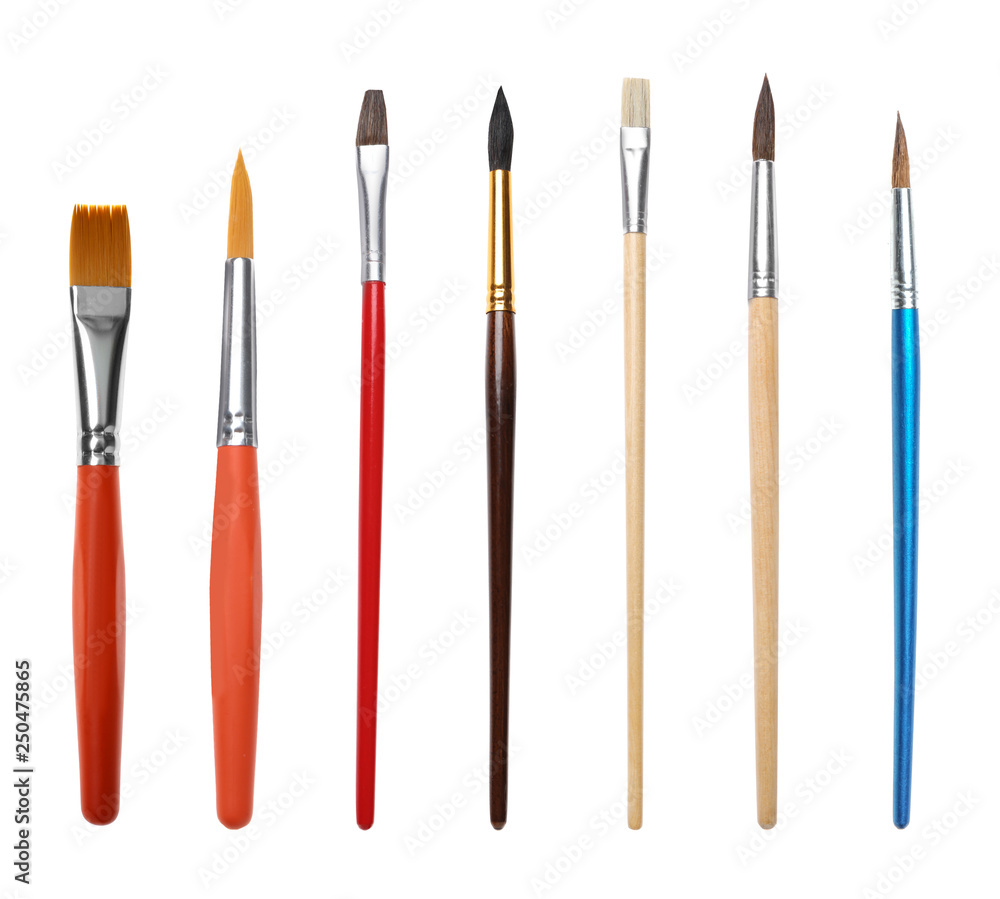 Set of different clean paint brushes on white background Set of different clean paint brushes on white background