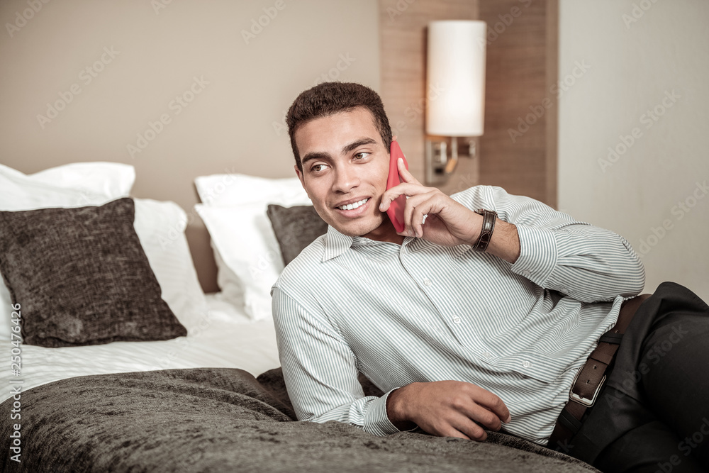 Businessman calling his wife after successful flight and trip