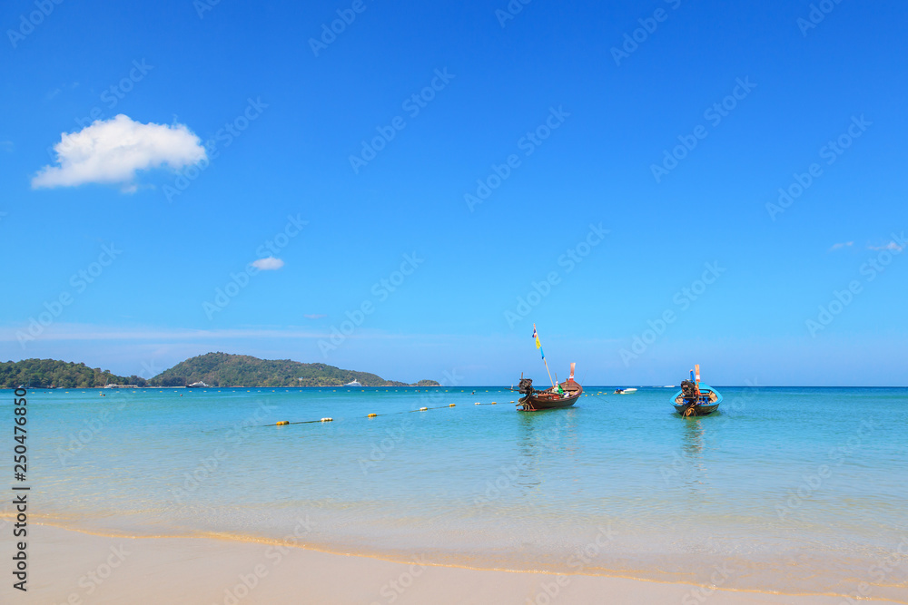 Long tail boats at the beautiful beach in Phuket, Thailand Long tail boats at the beautiful beach in Phuket, Thailand