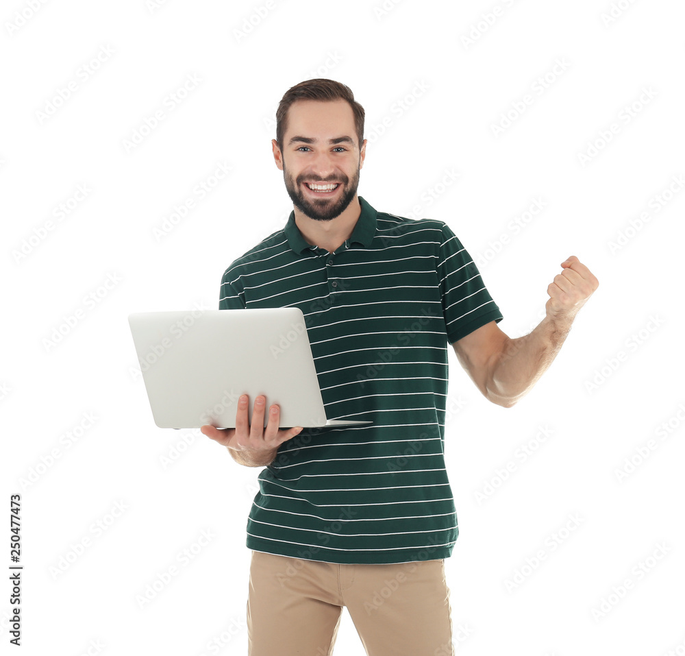 Emotional young man with laptop celebrating victory on white background Emotional young man with laptop celebrating victory on white background