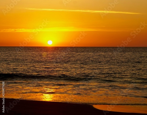 Fototapeta Naklejka Na Ścianę i Meble -  Sunset on the sandy shore