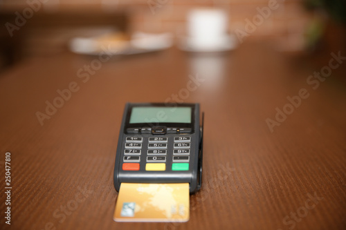 Terminal for contactless payment on table in restaurant