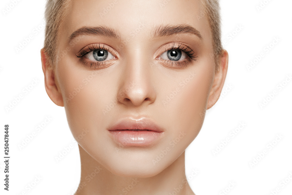 The beautiful female face. The perfect and clean skin of face on white. The beauty, care, skin, treatment, health, spa, cosmetic concept The beautiful female face. The perfect and clean skin of face on white. The beauty, care, skin, treatment, health, spa, cosmetic concept