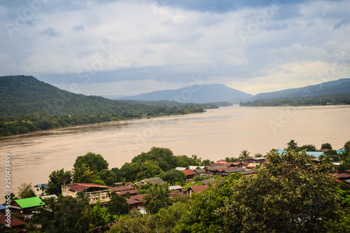 Beautiful landscape view of border village nearby Mun River Mouth, the point where the Mun and Mekong join in Khong Chiam District, the easternmost district of Ubon Ratchathani Province of Thailand. photo