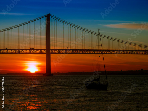 Ponte 25 de Abril - 25th of April Bridge on River Tagus at sunset, between Lisbon and Almada in Portugal