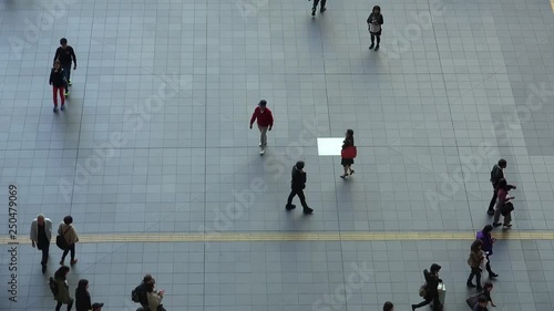 Chaotic movement of people on the tiled square, Timelapse. Japan