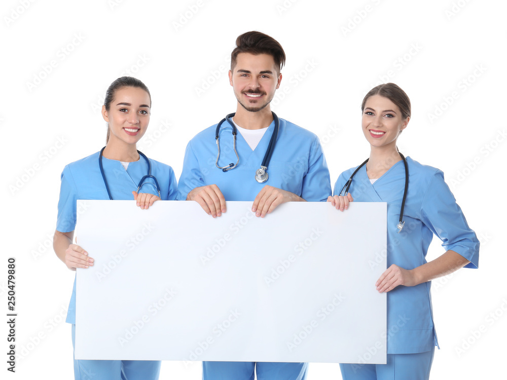 Medical students with blank poster on white background Medical students with blank poster on white background