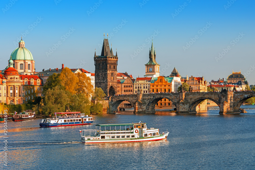Scenic view on Vltava rive, Charles bridge and historical center of Prague, buildings and landmarks of old town at sunset, Prague, Czech Republic Scenic view on Vltava rive, Charles bridge and historical center of Prague, buildings and landmarks of old town at sunset, Prague, Czech Republic