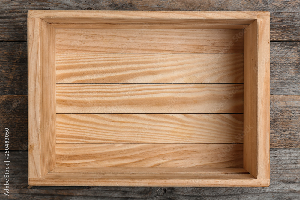 Empty crate on wooden background, top view Empty crate on wooden background, top view
