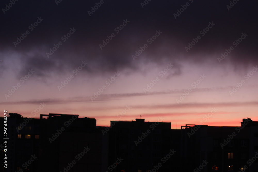 dawn against the dark sky with clouds, colorful sky from the rising sun