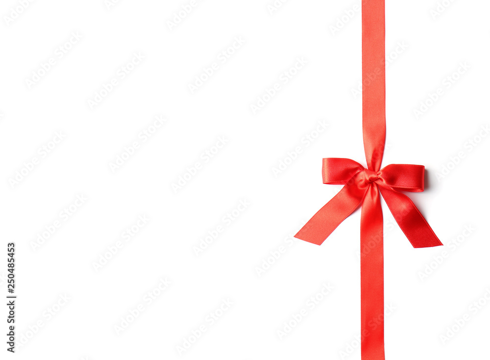 Red ribbon with bow on white background. Festive decoration Red ribbon with bow on white background. Festive decoration